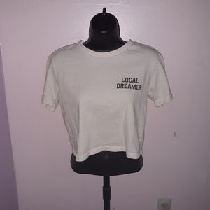 Loose white crop top with text